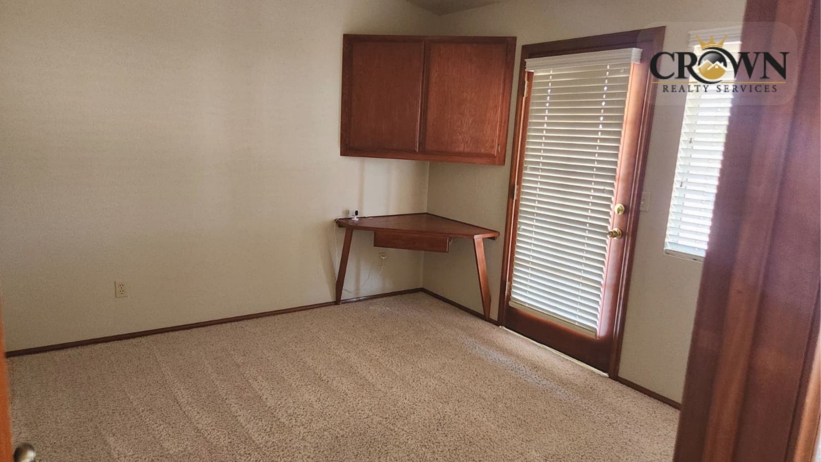 One of the three spacious and bright bedrooms inside the residential ranch property in Phelan.