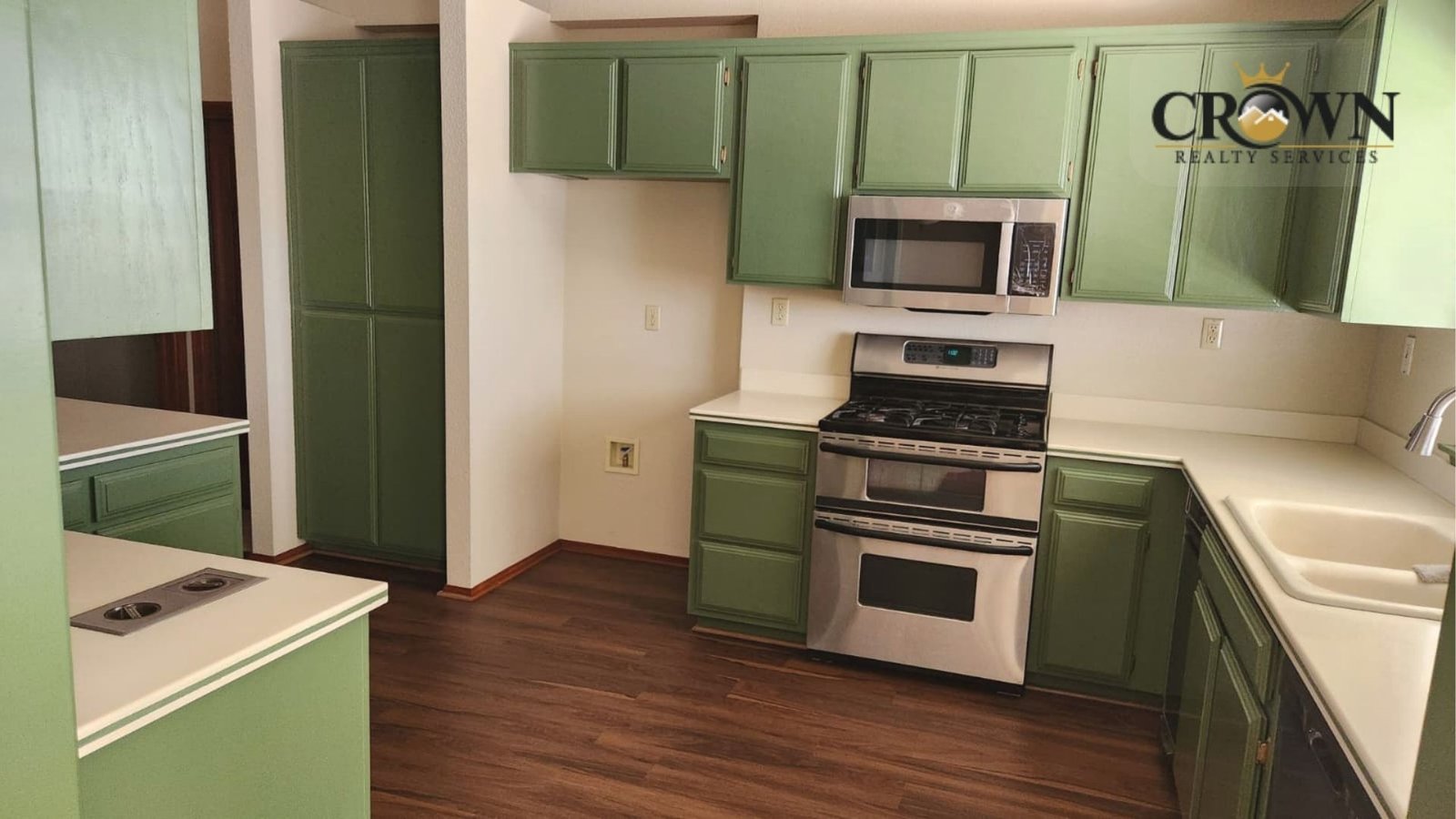 Interior view of the spacious kitchen with solid cabinetry and functional layout in the Phelan home.