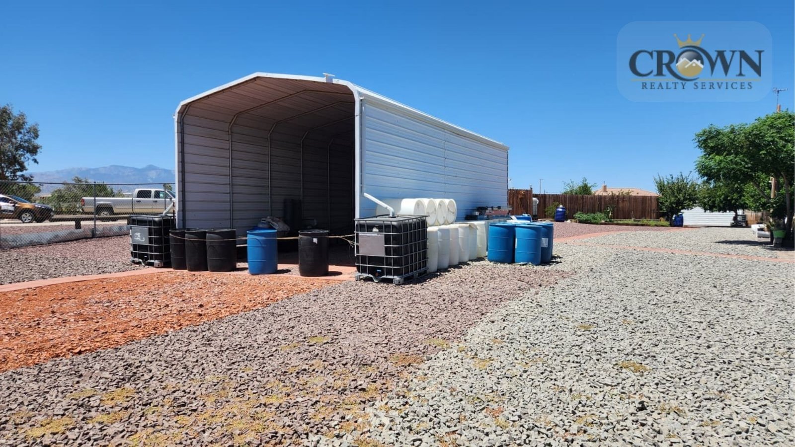Heavy-duty metal horse squeeze chute and livestock stock for veterinary care on a Phelan ranch.