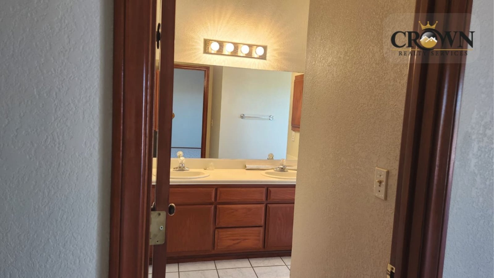 Clean full bathroom design featuring essential fixtures inside the Phelan CA home.