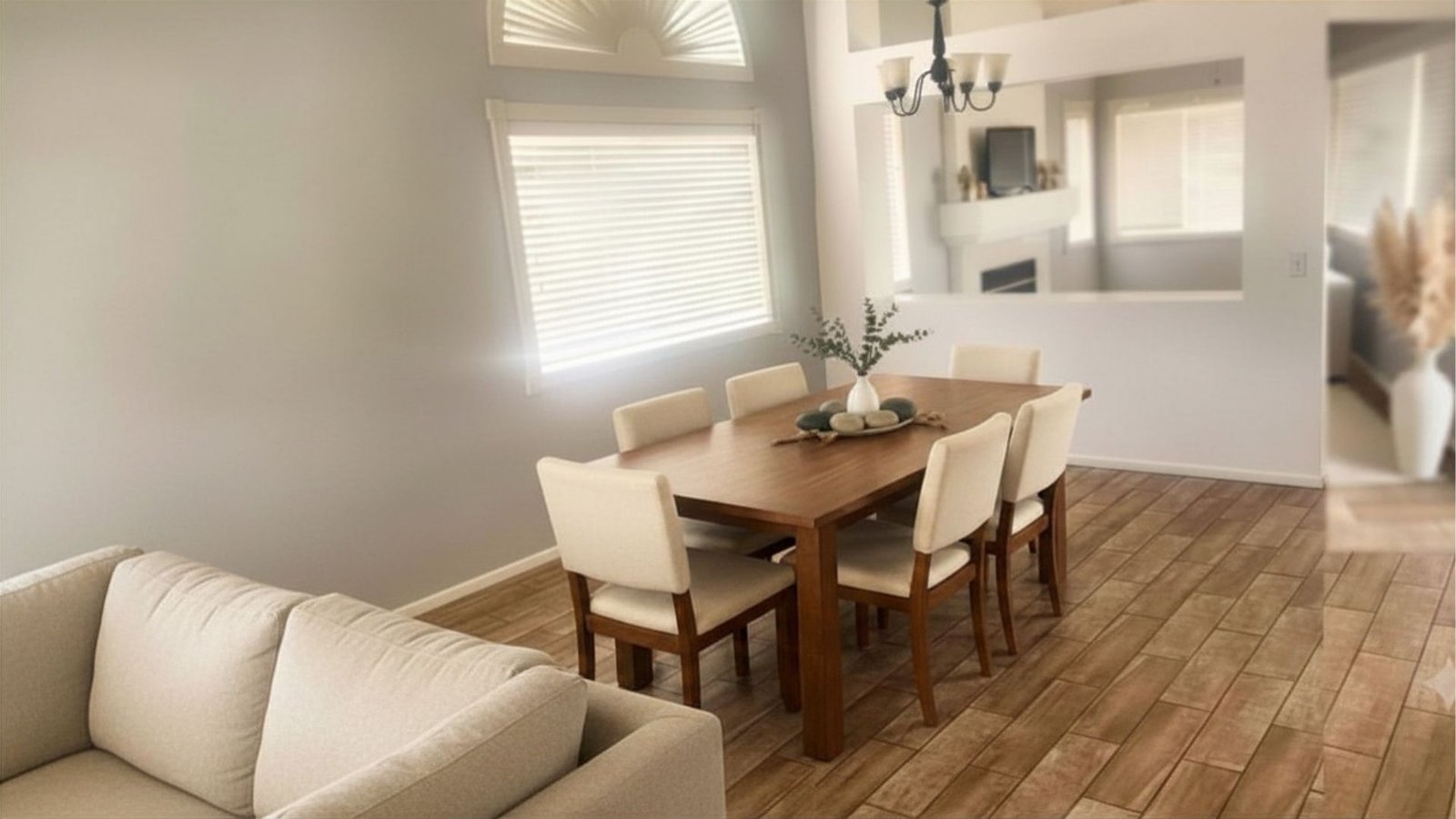 Spacious living and dining room with fresh paint and durable tile floors in Victorville CA home